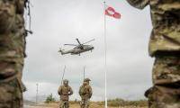 Russian frigate fires two flares at Danish military chopper, narrowly missing the NATO aircraft as Putin becomes increasingly aggressive
