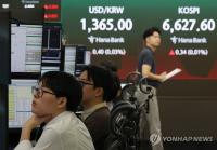 Seoul shares turn higher late Wed. morning on tech gains