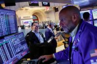 Stocks slide while oil continues to rise