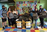 Back-to-School: Amazon DNI Carrier Team gives 200 filled Backpacks to Highlander Charter School children