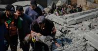 Building damaged by Israeli bombing collapses, killing 21 people including children