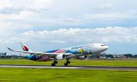 Man dies on Malaysia Airlines flight to Sydney before plane lands - as emergency crews rush to airport