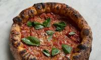 Small pizza chain in London is officially crowned world's best - becoming first British entrant to beat Italians at their own game