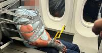 Man duct-taped to plane seat on flight breaks silence - 'what a mess'