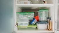 Reuse A Magazine Rack To Easily Declutter & Organize Plastic Food Container Lids
