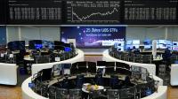 European shares rise as oil slips, yields stall