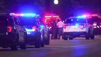 Toddler among seven injured in Baltimore shooting as police hunt for 'cowards' responsible