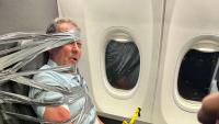 Religion debate kicked off 'racist rant' before American Airlines passenger was duct taped to seat