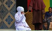 Lovers are flogged 100 times each for adultery with girlfriend begging for mercy then collapsing in pain during brutal Sharia caning in Indonesia