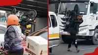 Nairobi boda boda rider carries motorcycle on shoulders to beat Ngong Road traffic jam