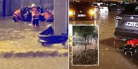 Torrential rain and deadly floods hit British holiday hotspot as 'red' alert issued
