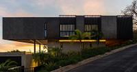 triangular layered residence by QBO3 arquitectos nestles on costa rican hillside