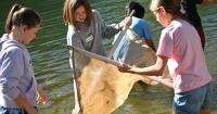 Students step into the Boise River for hands-on science