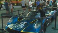 Motorsport cars arrive at Speedway Main Street before Battle on the Bricks race