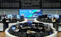 European shares inch lower as telecoms, energy shares dip