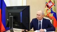 Moment Putin embarrasses himself voting in 'election he rigged'