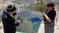 Israel moving ahead with settlement plans that would split West Bank in two, rights group says