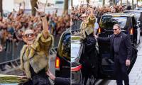 Celine Dion puts on an animated display as she greets crowds of her adoring fans with the help of her bodyguard ahead of another comeback show in Paris