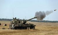 Israeli enemy shells outskirts of Al-Hamidiyah village in central Quneitra countryside