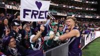 Airlines accused of gouging as Fremantle fans make way to the MCG for AFL grand final