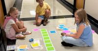 Commerce second graders learn coding with Indi robots