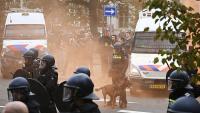 Police clash with far-right protesters at anti-immigration rally in The Hague