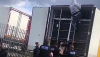 Shocking moment seven migrants are discovered hiding in lorry after arriving in Britain as driver arrested