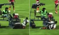 Bizarre moment former Premier League star is RUN OVER by a pitch rolling machine at half-time during match in Thailand