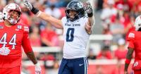 Utah State's Taggart leaves field in an ambulance; in concussion protocol and has a neck injury
