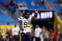 West Virginia beats No. 25 Virginia in the Duke’s Mayo Classic