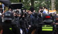 Police clash with hundreds of far-right protesters in The Hague