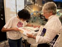 Pink Poster Club motivates Evanston voters at Midterms kickoff party