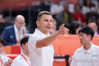 (LEAD) (Asiad) Latvian-born hoops coach for S. Korea silences critics with gold
