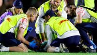 Rugby star knocked out one minute into his debut in worrying collision as medics rush to aid