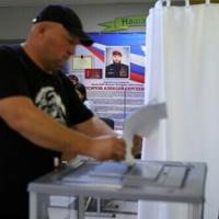 Russia vows revenge for election-day attacks as poll shows ruling party win