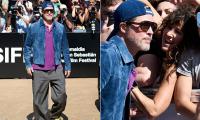 Brad Pitt is mobbed by fans as he arrives at San Sebastian Film Festival in Spain as friends reveal how marriage to Angelina Jolie sent his life 'spiraling'