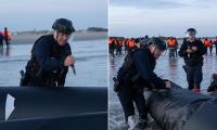French police slash migrant dinghy on beach as more asylum seekers land in Dover after crossing the Channel