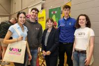 Economy Minister Dr Caoimhe Archibald welcomes students to Derry's Magee