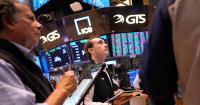 U.S. stocks slip after oil prices halt their drop and a strong economic report raises bond yields