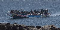 Three illegal migrants arrested after woman 'gang-raped on dinghy' in international waters