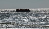 Woman 'is gang raped on migrant dinghy during Atlantic crossing': Three men are arrested