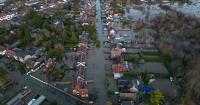 Insurance firms help flooding victims mop up. They also make flooding worse