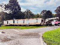 Man charged after manufactured home move damages roadway, railroad tracks in Clarke County