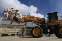Exclusive-How firms linked to sanctioned Chinese cotton giant sell clothes to U.S