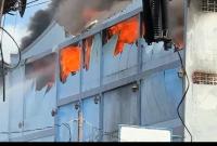 Fire guts Regent Household Electronics as public-spirited persons help fix leaking fire hose