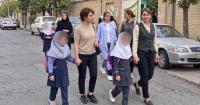 Bareheaded mother, veiled daughter: Iran's schools keep a rule its streets have dropped