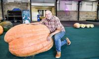 Gardeners showcase their giant vegetables at British contest - including 73st pumpkin and 24ft cucumber