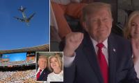 Donald Trump met with roaring cheers from college football fans in Tennessee after Air Force One flyover