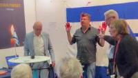 Man arrested after spraying red paint on Israeli flag at Sweden book fair | Watch