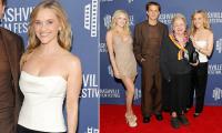 Reese Witherspoon looks much younger than age 50 as she poses with her mini-me daughter, son AND mother at premiere in Nashville